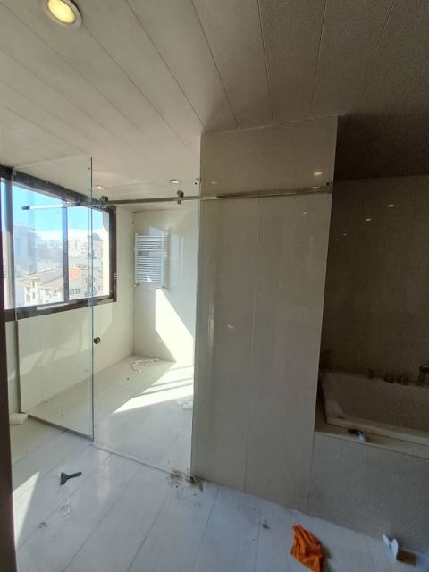 اجرای کرتین وال و نمای شیشه ای ساختمان در تهران